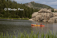 Stand-up paddle boaters and kayakers on Sylvan Lake, Custer State Park, SD