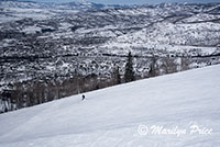 Skier on a ski run from a descending gondola, Steamboat Springs, CO