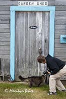 Julie and cat at garden shed door, Sequim, WA