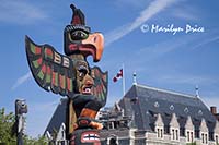 Totem poles and The Empress Hotel, Victoria, BC