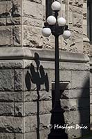 Lamppost and shadow, grounds of British Columbia Parliament Building, Victoria, BC