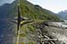 View along the side of the train as it travels along the Turnagain Arm of Cook Inlet, Alaska